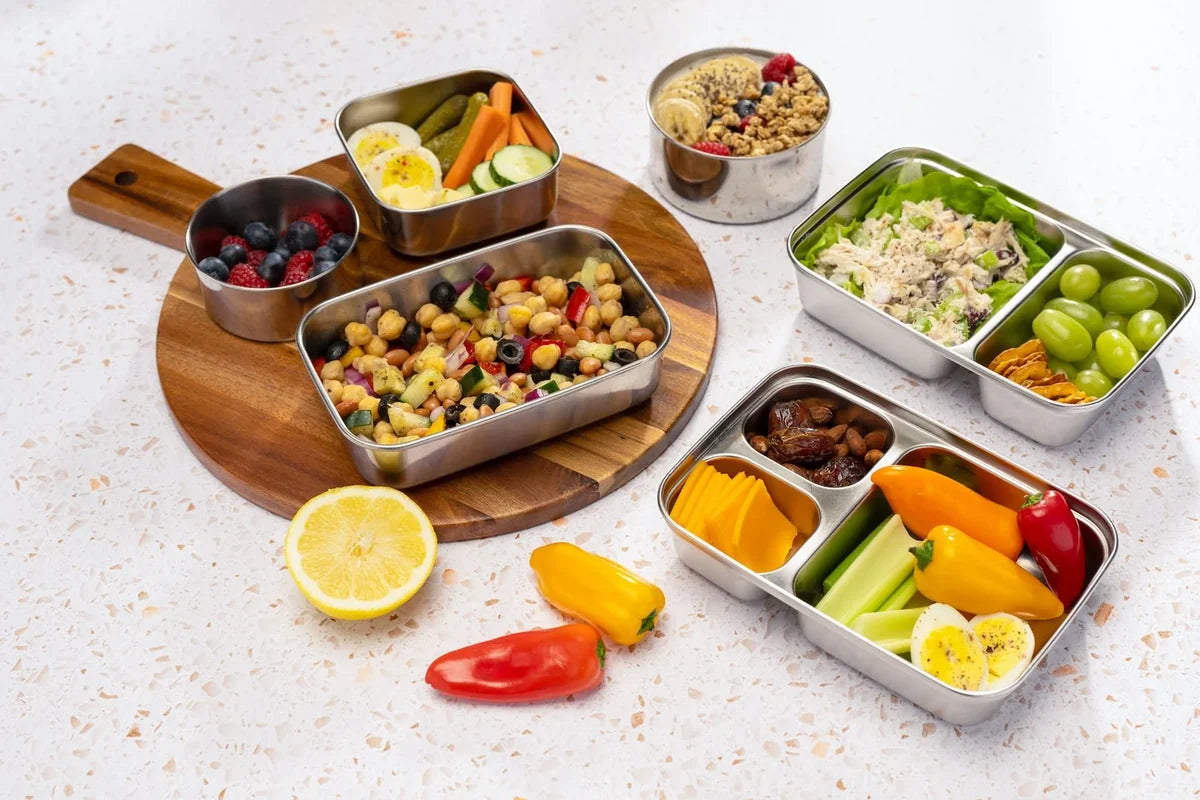 U-Konserve stainless steel lunch boxes and rounds packed with fresh salads, fruit and snacks