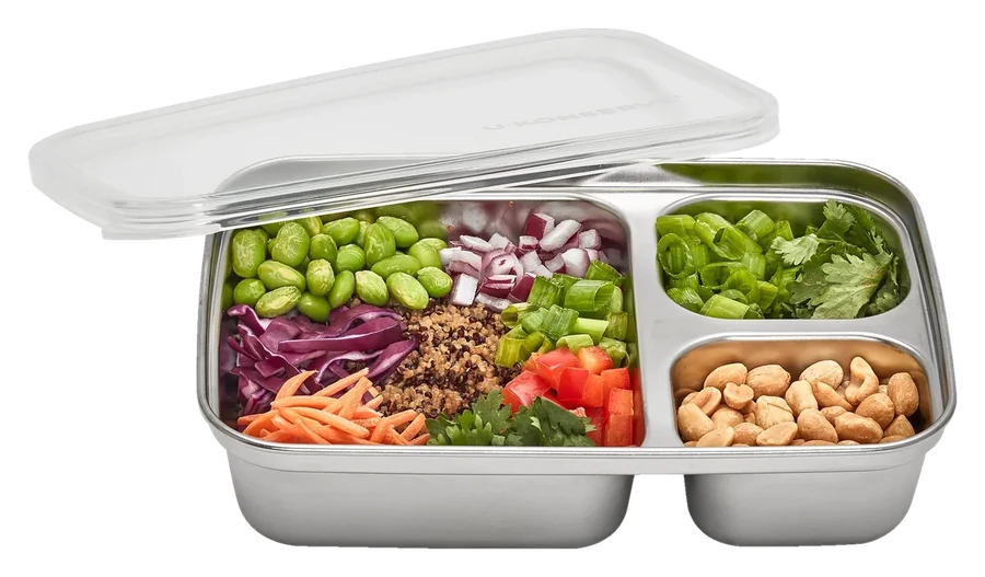 The same container with the lid lifted, packed with edamame, quinoa, red cabbage, capsicum, spring onion and peanuts