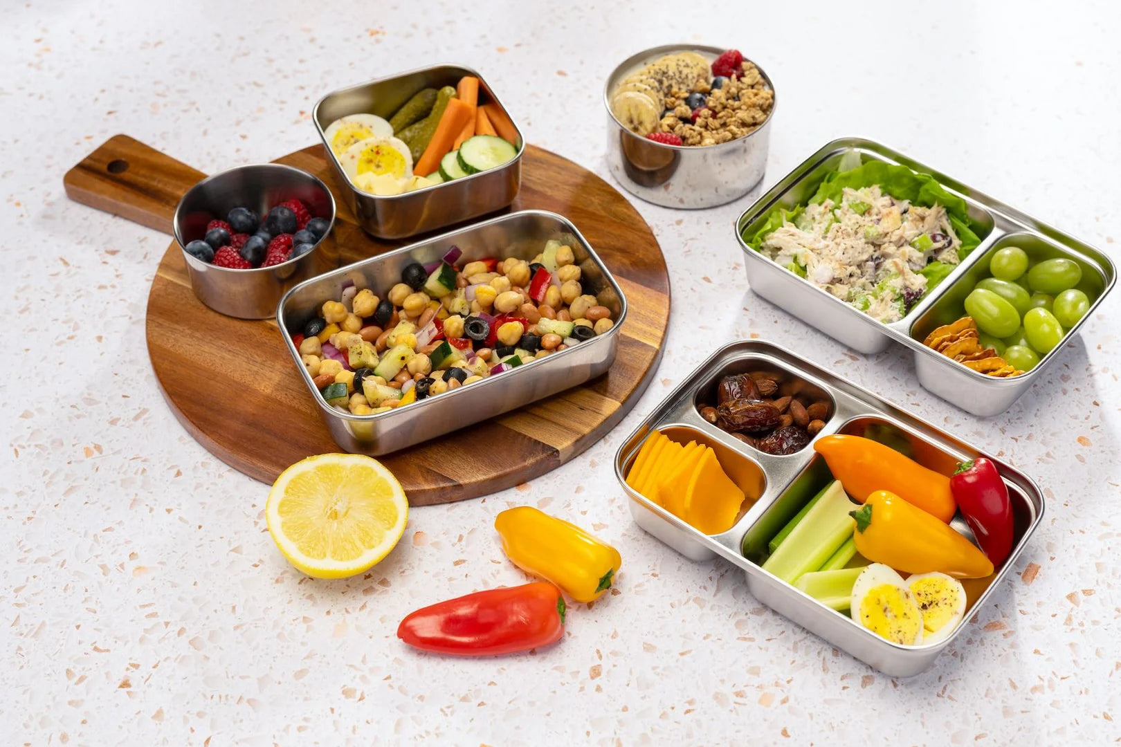U-Konserve stainless steel lunch boxes and rounds packed with fresh salads, fruit and snacks